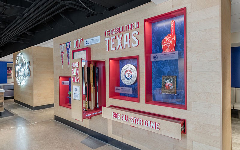 Custom-built_cabinetry_houses_autentic_autentic_bats_and_balls_used_by_Rangers_legends